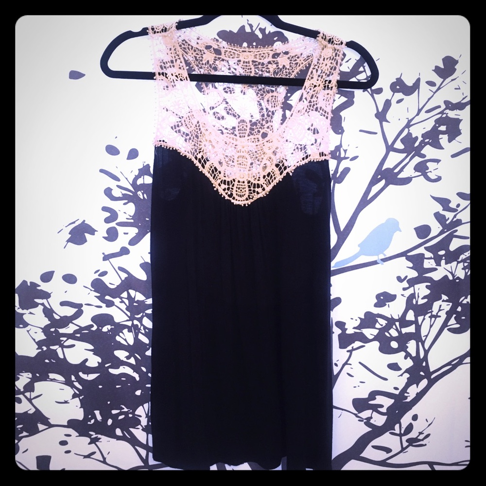 Sleeveless navy tunic with crocheted detailing